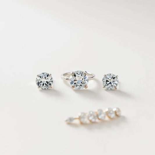Moissanite ring with matching studs and bracelet on a neutral studio background