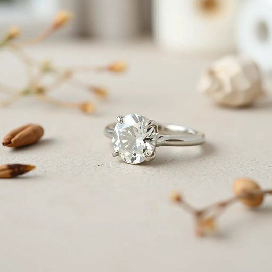 Sparkling moissanite engagement ring with a centered stone on a neutral background
