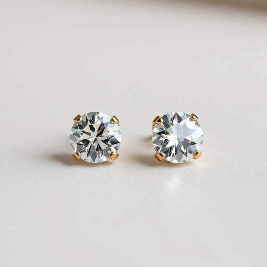 Sparkling round moissanite stud earrings on a clean light background